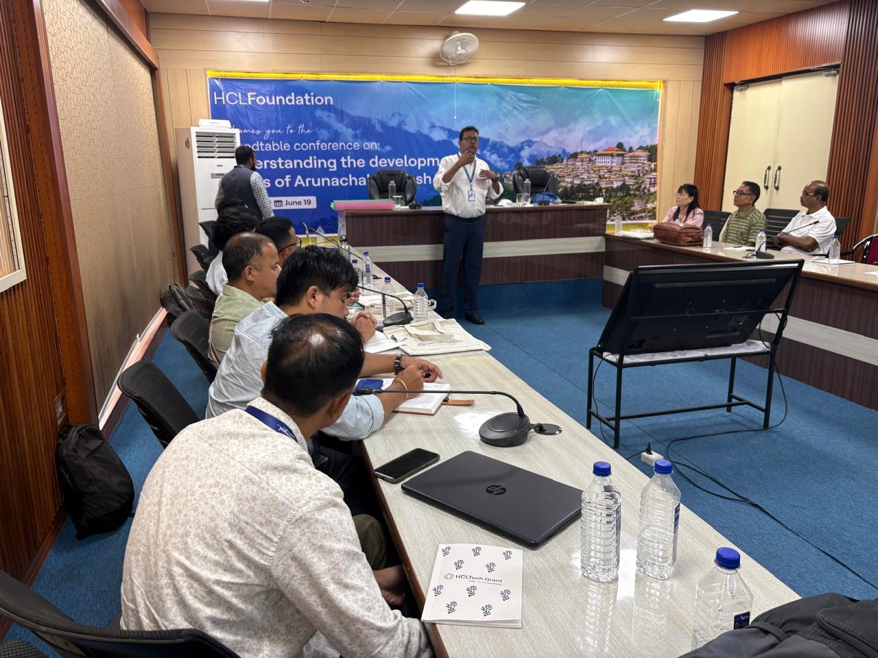 Speaker addressing participants during the HCLFoundation roundtable conference in Itanagar